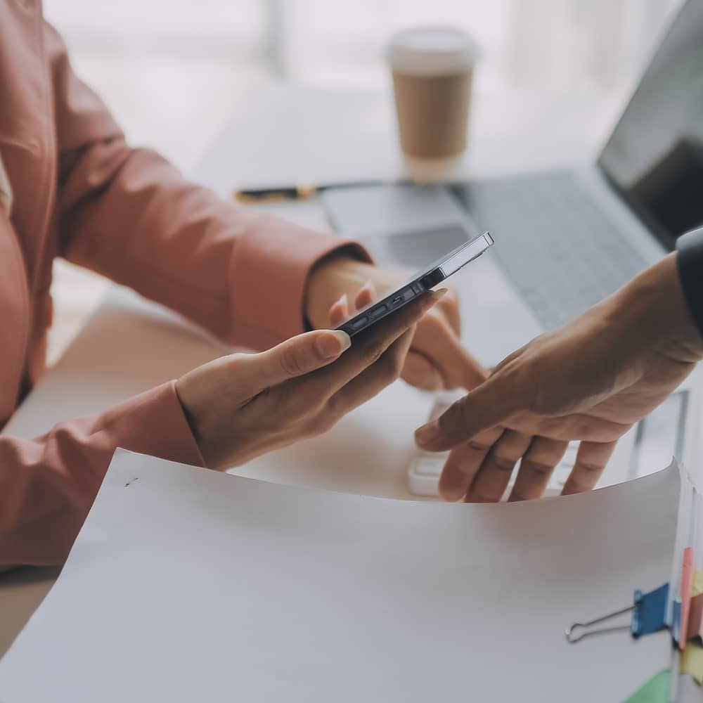 hands at a desk