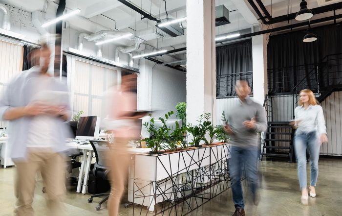 people walking in an office